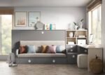 Sofa integrated into a folding bed with a pull-out trundle and desk
