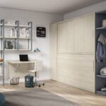 Horizontal folding bed with integrated wardrobe